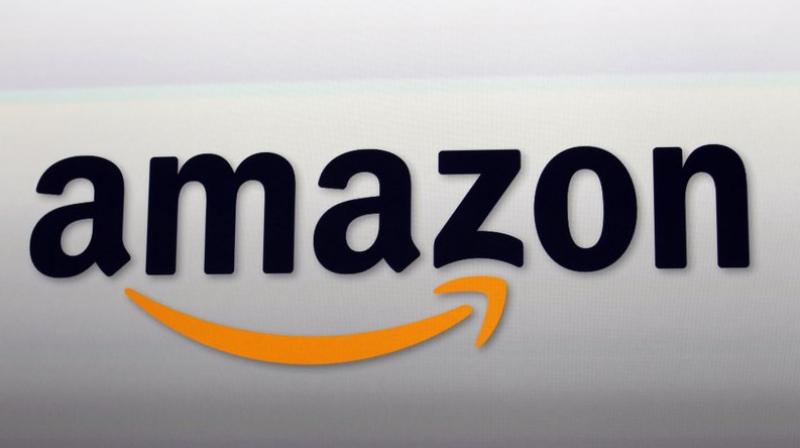 This September 6, 2012, file photo, shows the Amazon logo. The American Civil Liberties Union and other privacy activists are asking Amazon to stop marketing a powerful facial recognition tool to police, saying law enforcement agencies could use the technology to  easily build a system to automate the identification and tracking of anyone.  (AP Photo/Reed Saxon, File)