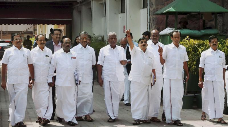 Former Tamil Nadu Chief Minister O Panneerselvam with AIADMK Rajya Sabha MP V Maitreyan and senior party leaders. (Photo: PTI)
