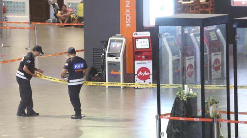 Police cordon off an area with tape for a police reenactment with a suspect in the North Korean murder at the KLIA2 budget terminal at the Kuala Lumpur International Airport in Sepang, Malaysia. (Photo: AP)
