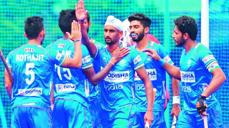 Members of the Indian mens  teams celebrate goals during the finals of the Olympic Test event in Tokyo on Wednesday.