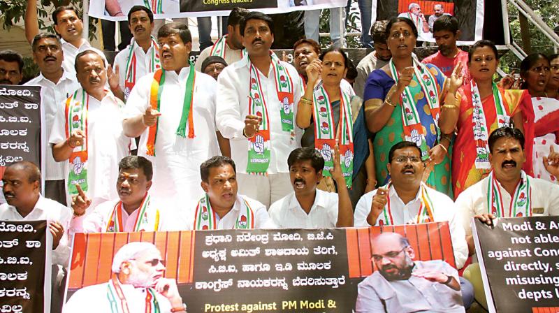 Congress workers protest CBI raid on former aide of D.K. Shivakumar 	(Image: DC)
