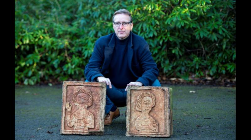 Dutch art detective Arthur Brand with the two recovered stone Visigoth reliefs. (Photo: AFP)
