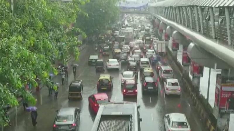 The rains have led to massive traffic jams on Western Express Highway and other parts of the city. (Photo: ANI | Twitter)