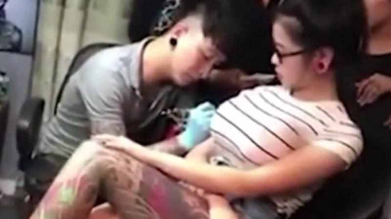 Watch: Girl's breast bursts in tattoo artist's face  Watch: Girl's breast  bursts in tattoo artist's face