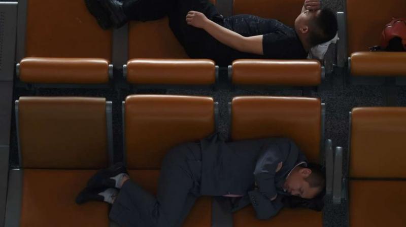 Bosses should consider allowing staff to take a short nap in the office (Photo: AFP)