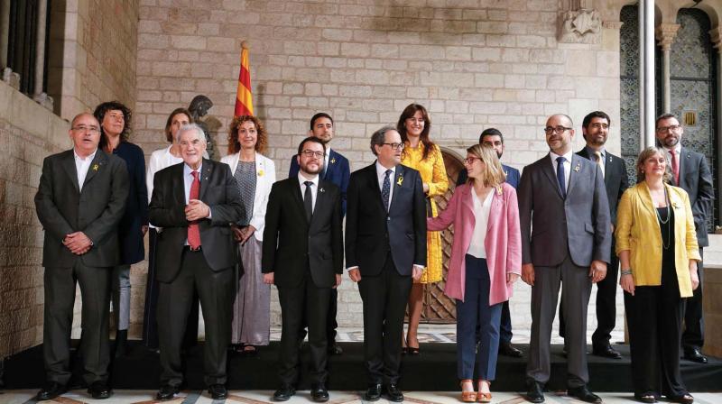 Catalonias new regional government members pose after taking office during an official swearing-in ceremony at the Generalitat Palace in Barcelona on June 2, 2018. (Photo: AFP)