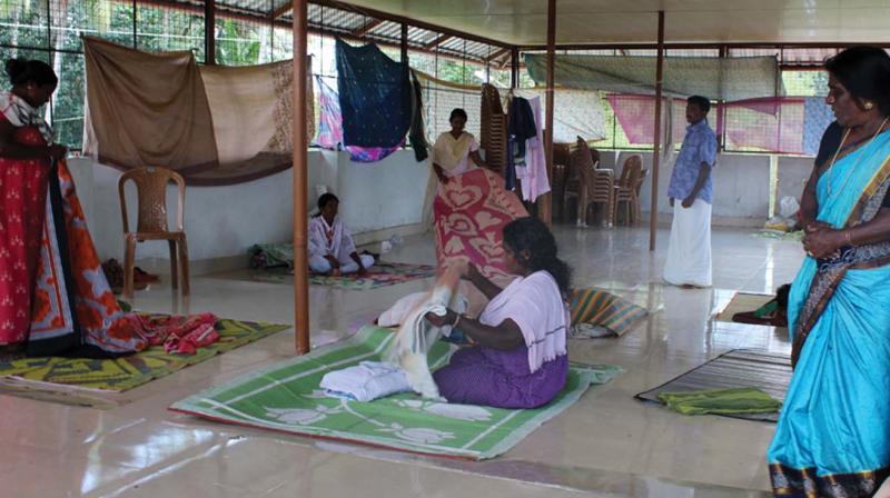A few family members who took refuge on the rooftop of Homeo clinic of Pandanad panchayath                                           -A file pic