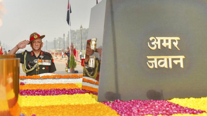 Chief of Army Staff, General Bipin Rawat pays homage to the Martyrs, on the occasion of Infantry Day, at the Amar Jawan Jyoti, India Gate in New Delhi. (Photo: PTI)