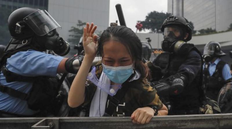 Hong Kong shuts govt offices after violence ensues in protests over extradition bill