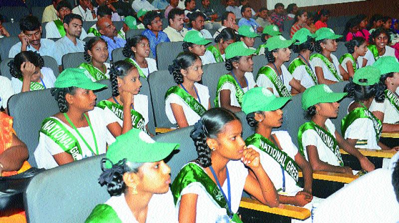 Children from various schools listen to speeches by the dignitaries during a seminar on World Water Day at YVS Murthy Auditorium inside AU Engineering College Campus in Visakhapatnam on Thursday. (Photo: DC)