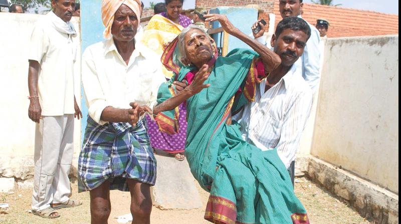 110-year-old Devamma being carried to a polling booth at Mukkadahalli in Gundlupet constituency on Sunday. (Photo: KPN)