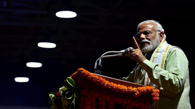 Prime Minister Narendra Modi addresses supporters at the party headquarters to celebrate victory in UP and Uttarakhand Assembly elections, in New Delhi on Sunday. (Photo: PTI)