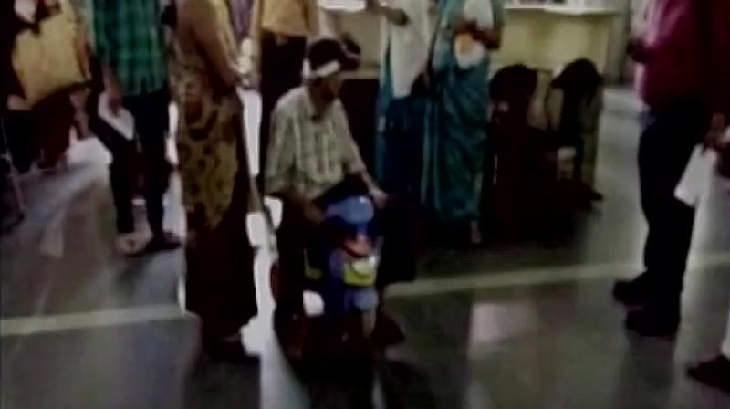 S Rajus wife Santoshi alleged as she did not have money to pay \tips\ to the ward-boys, he was not being given wheelchairs and had to use a tricycle to move around in the hospital. (Photo: ANI Twitter)