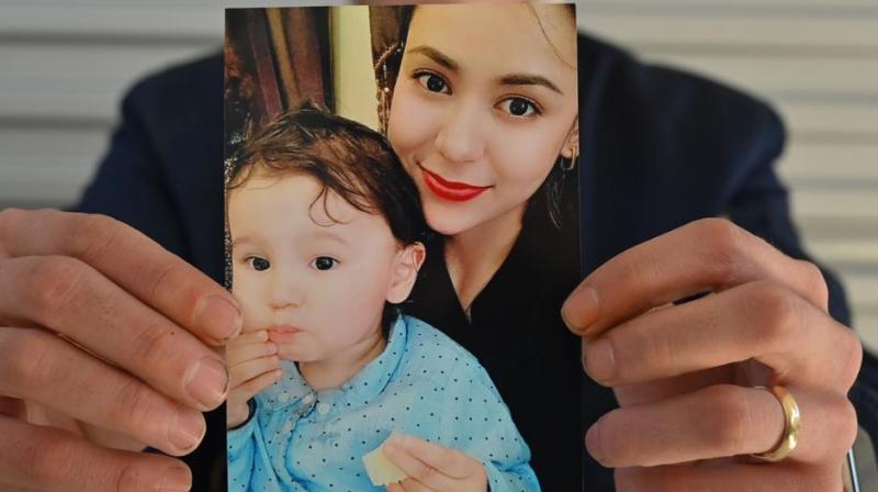 Australia calls on China to allow Uighur mother and son leave country