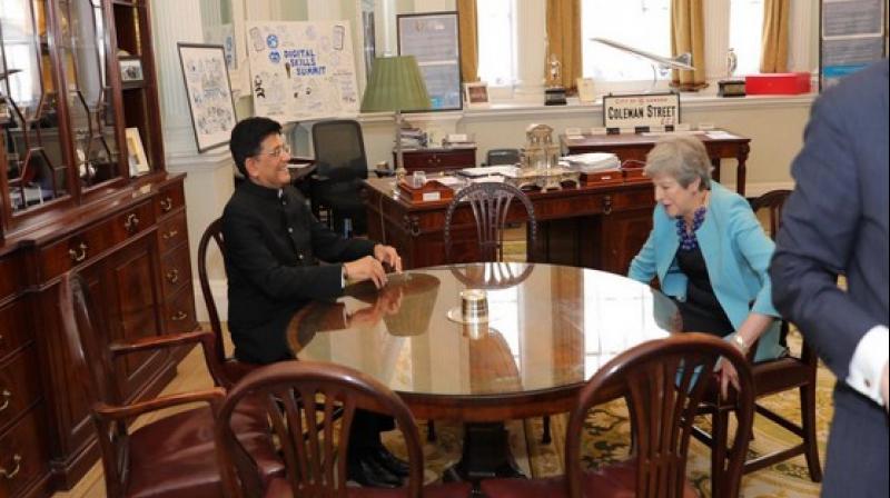 Piyush Goyal meets Theresa May in London