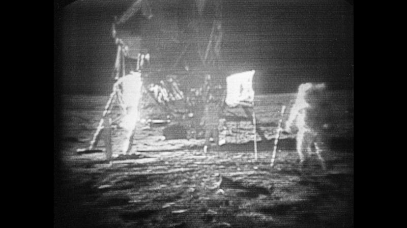 FILE - In this July 20, 1969 file photo, Apollo 11 astronaut Neil Armstrong, right, trudges across the surface of the moon leaving behind footprints. Moon dust collected by Armstrong during the first lunar landing is being sold at a New York auction. The lunar dust plus some tiny rocks that Armstrong also collected are zipped up in a small bag and are worth an estimated $2 million to $4 million. Theyre just some of the items linked to space travel that Sothebys is auctioning off to mark the 48th anniversary of the first lunar landing on July 20. (AP Photo, File)