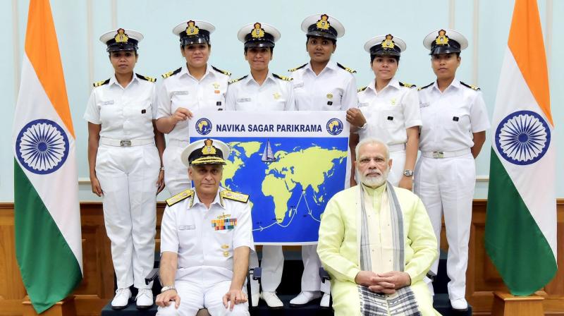Prime Minister, Narendra Modi with the Six women officers of the Indian Navy who are due to circumnavigate the globe on the sailing vessel INSV Tarini, in New Delhi on Wednesday. Chief of Naval Staff, Admiral Sunil Lanba is also seen. (Photo: PTI)