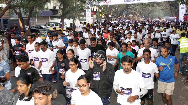 People take part in Cancer Day walkathon organised at Indiranagar in Bengaluru on Sunday (Photo: KPN)