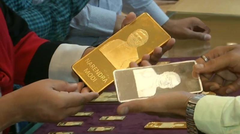 A jewellery shop in Surat has attracted customers by selling gold and silver bars with imprints of PM Modi and former PM late Atal Bihari Vajpayee. (Photo: ANI)