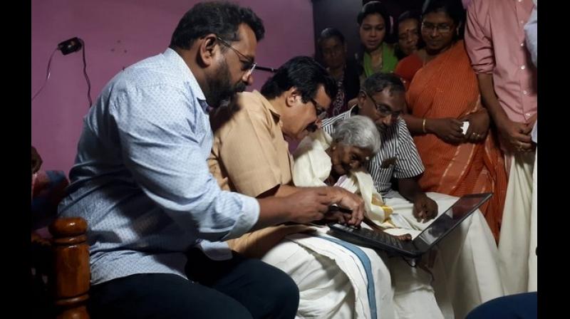 Last week, the nonagenarian had expressed her desire to learn computers. To fulfill this, state education minister C Raveendranath visited her home and gifted her a laptop. (Photo: ANI)