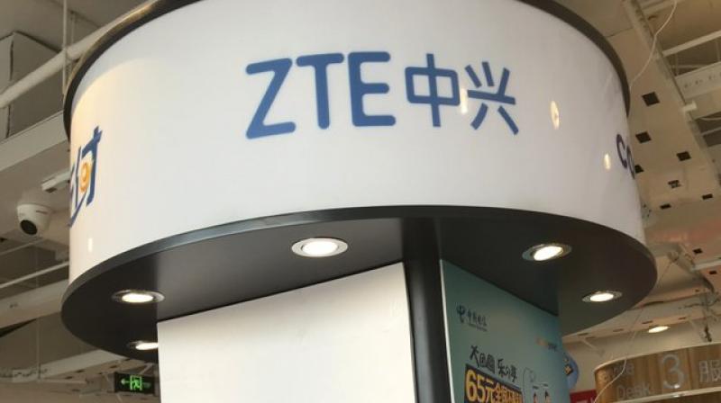 ZTEs logo is seen in a telecommunication services shop in Beijing Wednesday, July 4, 2018. Tech giant ZTE Corp.s near-death experience after Washington barred it from buying US components was a stark reminder that Chinas industry leaders cannot function without American technology. (AP Photo/Ng Han Guan)