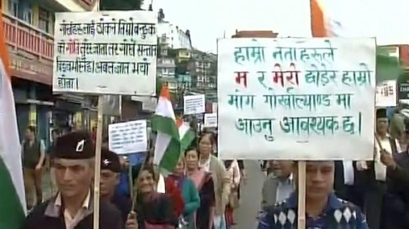 Protestors took to the street of Darjeeling in demand of a separate Gorkhaland. (Photo: Twitter | ANI)