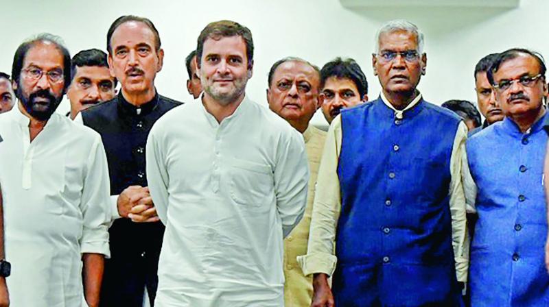 Congress leader Rahul Gandhi and Ghulam Nabi Azad, Left party leader D. Raja and DMK MP Tiruchi Siva return from Srinagar, at IGI Airport in New Delhi on Saturday.   (PTI)