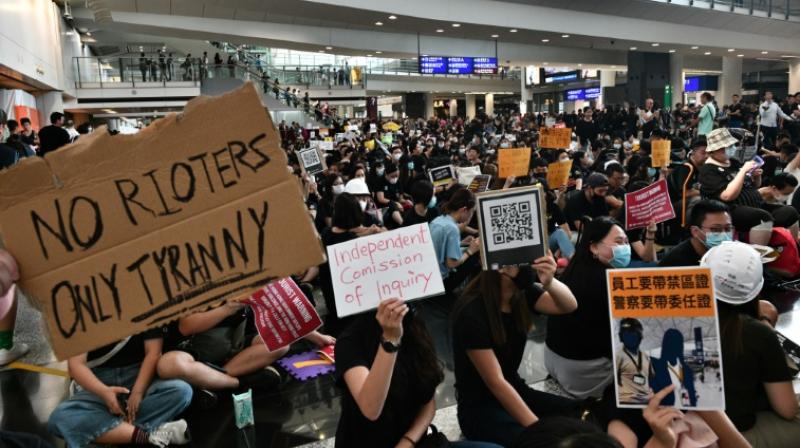 Hong Kong protesters rally at airport to \educate\ visitors