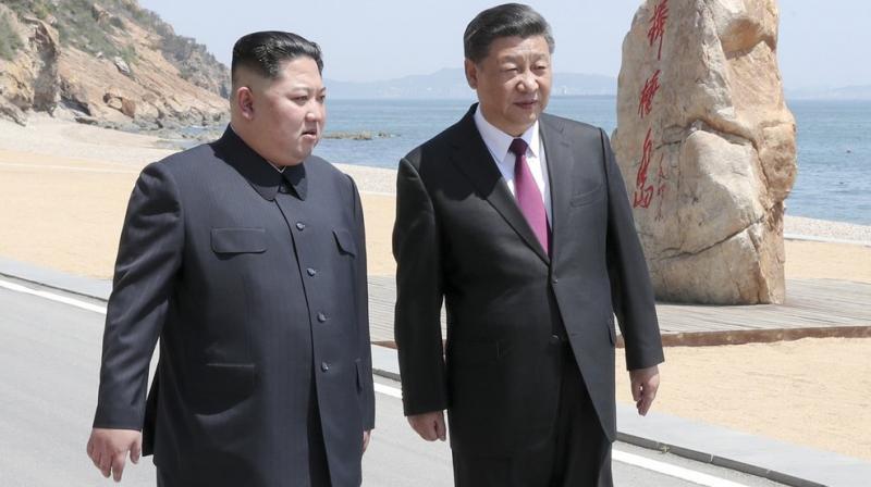 Chinese state broadcaster CCTV showed Xi and Kim taking a seaside stroll in the northeastern city of Dalian and holding talks. (Photo: @XHNews | Twitter)