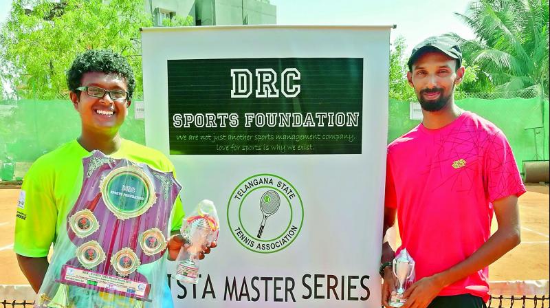 Sanjeev Mohan Kumar (left) and Kevin Markandarajah of Sri Lanka pose with their trophies at the TSTA Master Series tennis tournament at the St Thomas High School in Neredmet, Hyderabad.