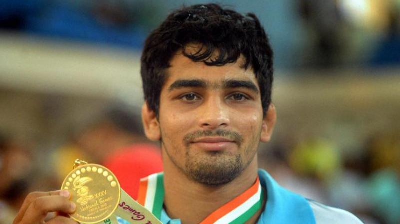 Sandeep Tomar won the gold in mens 57kg freestyle by defeating Pakistans Mohammad Bilal 6-0. (Photo: PTI)
