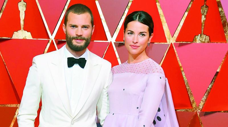Jamie Dornans wife Amelia Warner hasnt watched him in any of the Fifty Shades Of Grey films.
