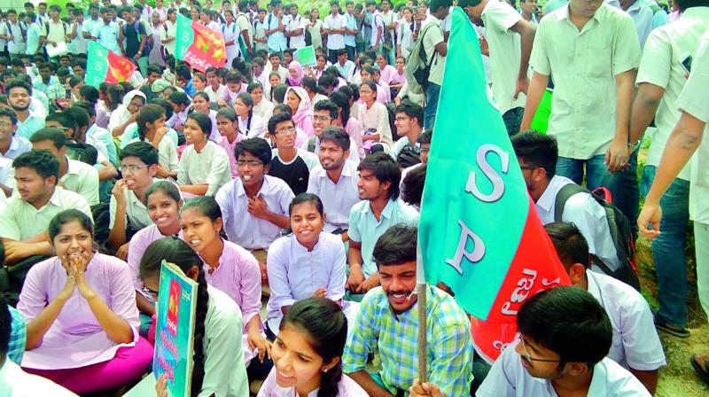 Students and their parents stage a protest outside the Sreenidhi Institute of Science and Technology campus in Ghatkesar on Wednesday against abnormal fee hike.