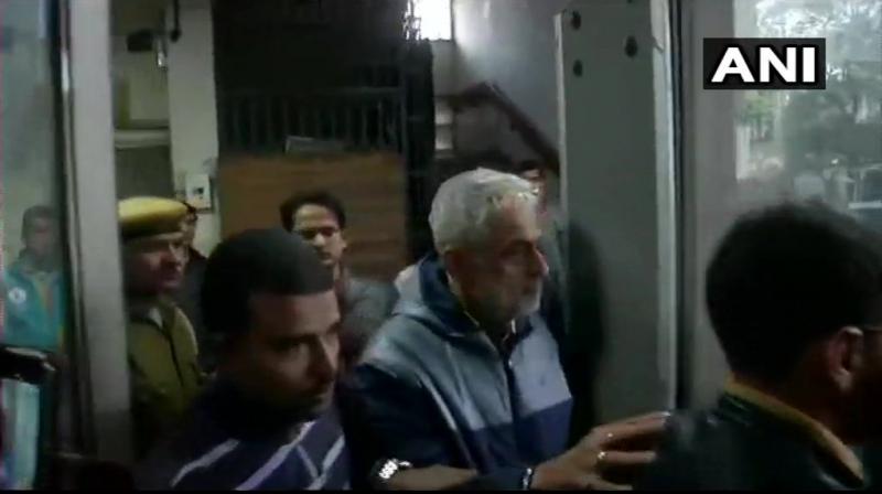 Corporate lobbyist Deepak Talwar (white haired), also one of the accused in the same case was produced before the court. (Photo: ANI)