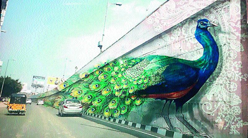 3D art coming up for the first time in India on flyovers. Theme is based on national bird peacock and Telangana state bird Palapitta. (Photo: DC)