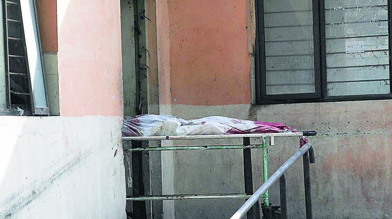 An unidentified body being wheeled out of the Osmania Generala Hospital mortuary on Saturday. (Photo: DC)