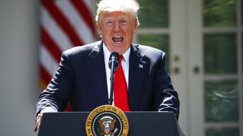 President Donald Trump speaks about the U.S. role in the Paris climate change accord, Thursday, June 1, 2017, in the Rose Garden of the White House in Washington. (Photo: AP)