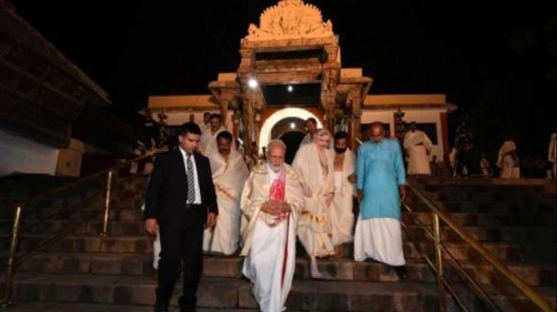 Modi, who was accompanied by Governor Justice P Sathasivam entered sprawling shrine through the eastern entrance and spent about 20 minutes there. (Photo: PIB_India | Twitter)