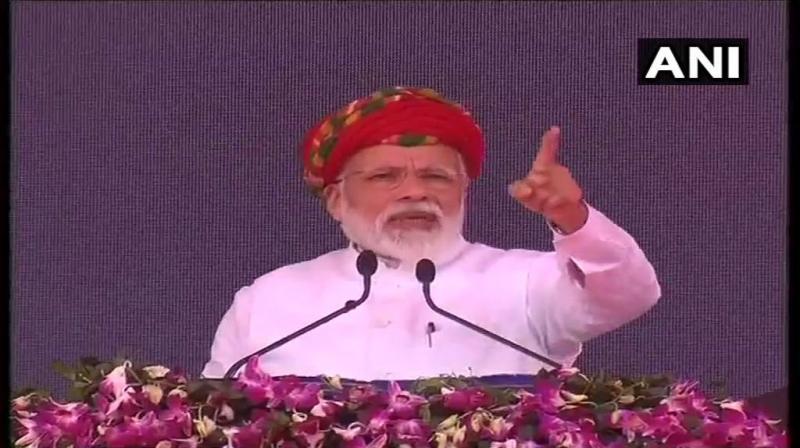 Prime Minister Narendra Modi on Monday addressed the public meeting in Jamnagar on a two-day visit to Gujarat. (Photo: ANI/ twitter))