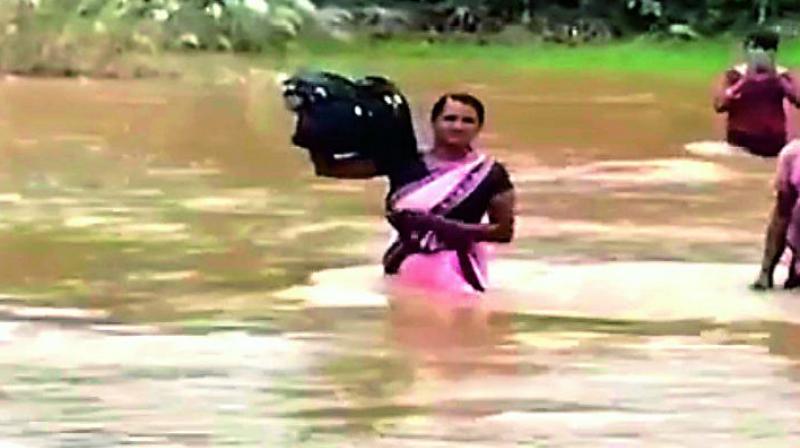 Bhubaneshwar: Wading through a river to teach at school, daily