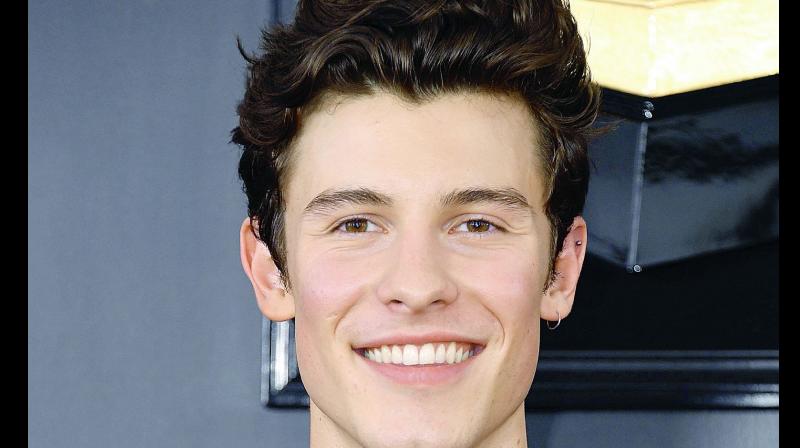 Watch: Shawn Mendes wins hearts as he lets fan kiss him at Denver concert