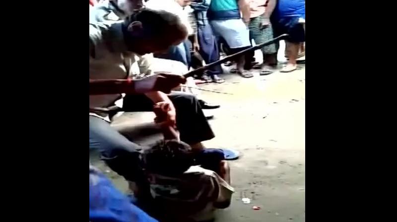 Two police personnel were suspended on Tuesday after video of them surfaced brutally beating up two children on suspicion of theft. (Photo: ANI | Twitter)