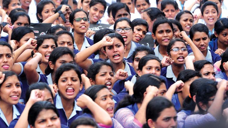 The nursing students and striking nurses protest near Kannur collectorate on Tuesday. (Photo: DC)