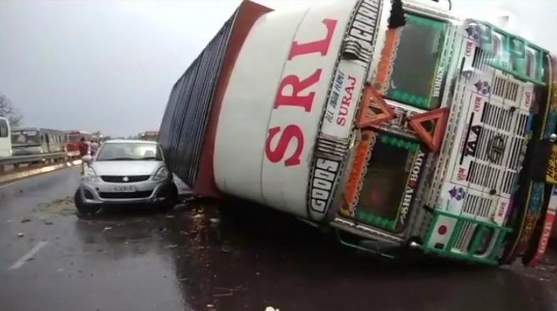 Several vehicles turned turtle and fell on each other on Delhi-Kanpur Highway, following heavy rainfall and dust storm in Bulandshahr on Sunday. (Photo: ANI | Twitter)
