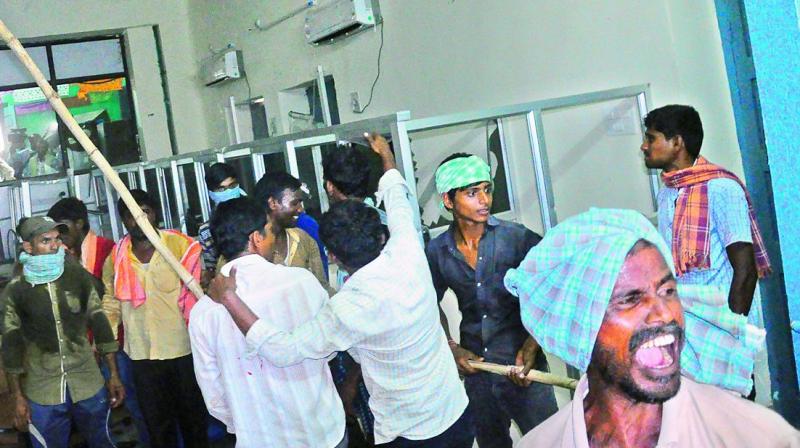 Farmers, angry at their produce not being quoted remunerative prices, vandalise the Khammam market yard chairmans office on Thursday.