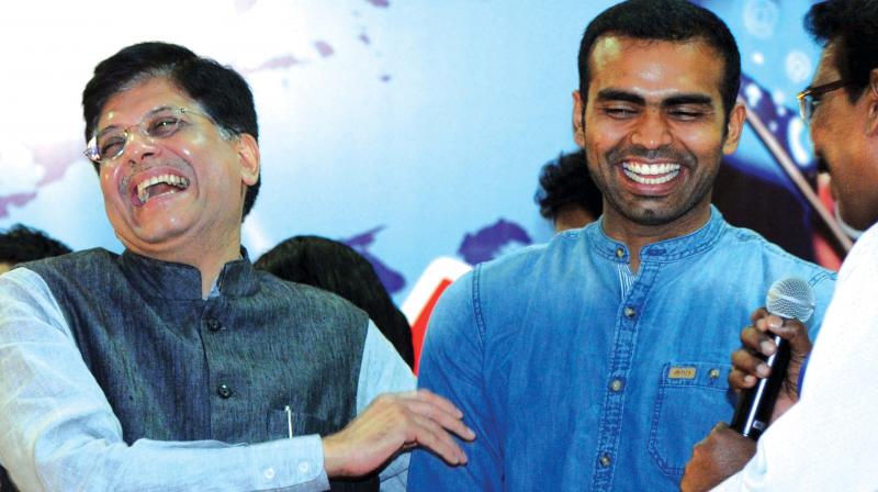 Union minister of state of power Piyush Goyal shares a light moment with  Indian hockey team captain PR Sreejesh during the inauguration of Digi Dhan Mela in Kochi on Tuesday (Photo: ARUNCHANDRA BOSE)