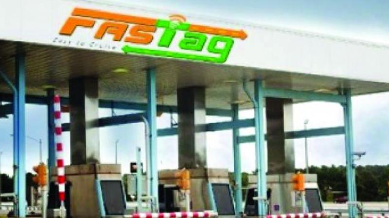 Toll gates to stay, FASTags must in 4 months