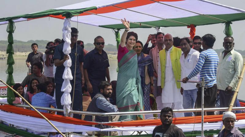 Congress General Secretary and Eastern Uttar Pradesh incharge Priyanka Gandhi Vadra waves at her supporters during Boat pe Charcha as she starts her partys campaign for the Lok Sabha elections in UP, in Prayagraj (Allahabad). (Photo: PTI)