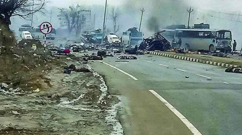 A scene of the spot after militants attacked a CRPF convoy in Goripora area of Awantipora town in Pulwama district of J&K on Thursday. At least 49 CRPF jawans were killed in the attack. (Photo: PTI)