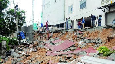 A five-foot wall collapsed on the main electric wires and transformer at ragathinagar causing severe damage. 	 (Deepak Deshpande)